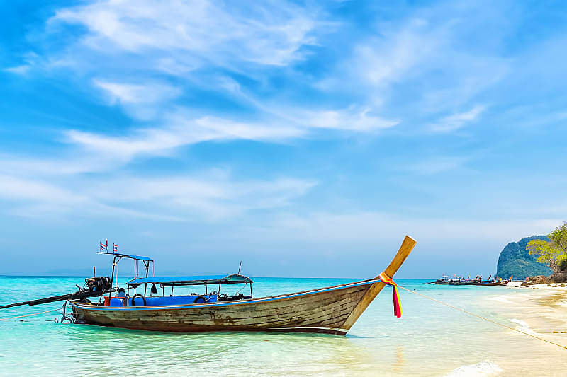 Fishing boat on the white sandy beach of Koh Samui island, Taiand