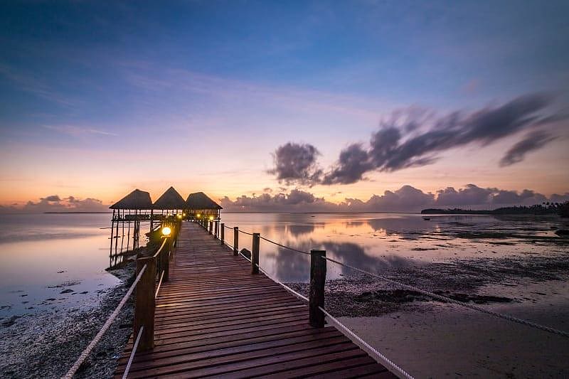 Peaceful Zanzibar & Safari Vacation for Seniors - Beach Dock at Sunset Sunset at beach dock in Zanzibar, Tanzania