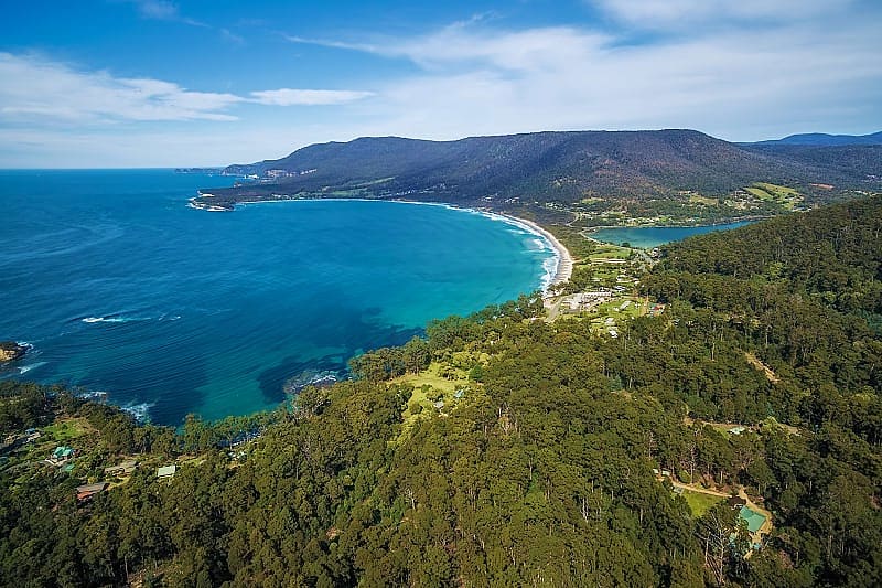 Tropical jungle connects to the iridescent sea, Australia