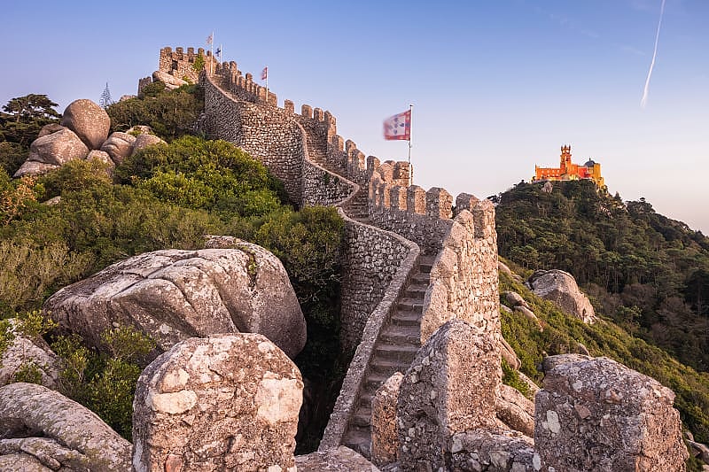Castle of the Moors, with Pena Palace on the hill on the background, in Sintra Castle of the Moors, with Pena Palace on the hill on the background, in Sintra
