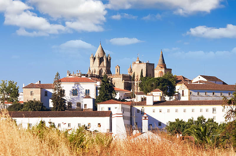 Washed buildings surrounding the Cathedral in Evora, Portugal