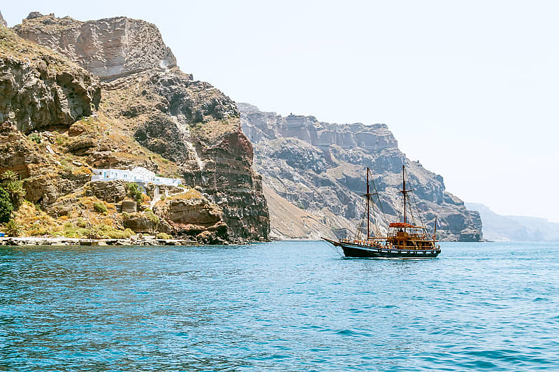 Ship on the background of rocks. Santorini island
