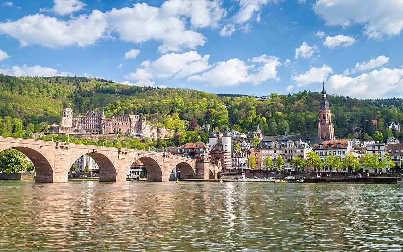 The Carl Theodor Old Bridge and church of holy spirit located next to Neckar river in Heidelberg, Germany
