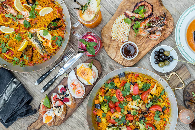 Savor the flavors of homemade food and big city cuisine on this trip to Spain