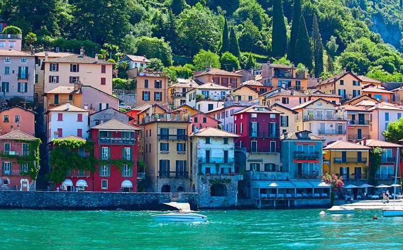 Colorful houses on a hillside bordering Lake Como in Lombardy, Italy