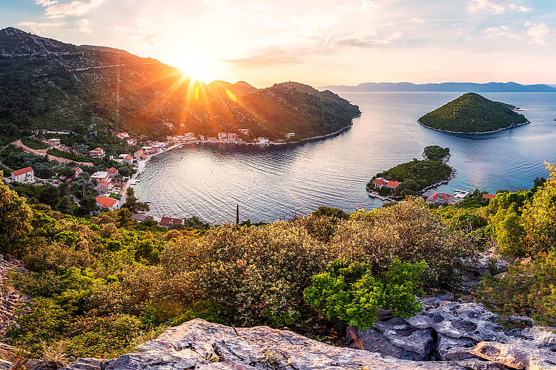 Luxury Island Hopping Vacation in Croatia - Mljet Sunset behind Prozurska Luka on the island Mljet in Croatia