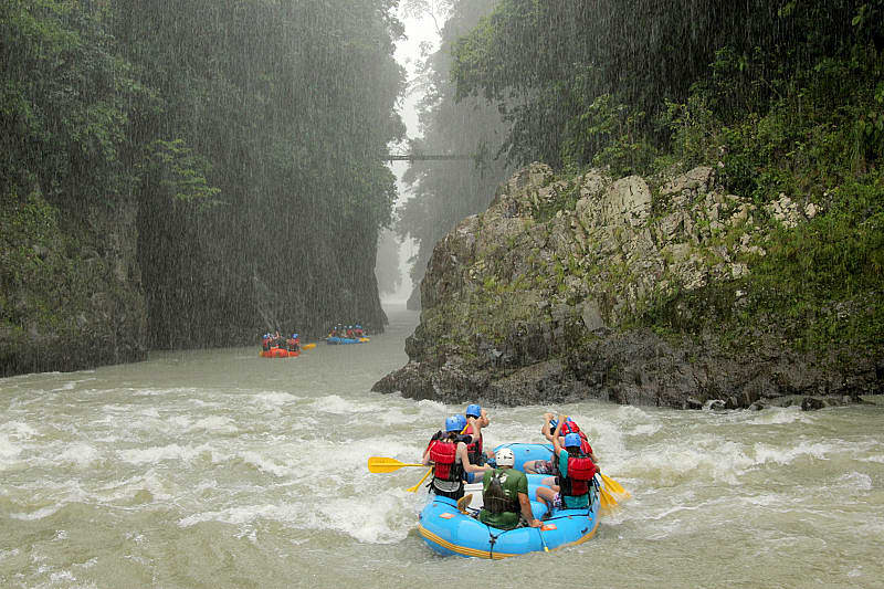 Rafting down the mountain river along the stunning waterfalls