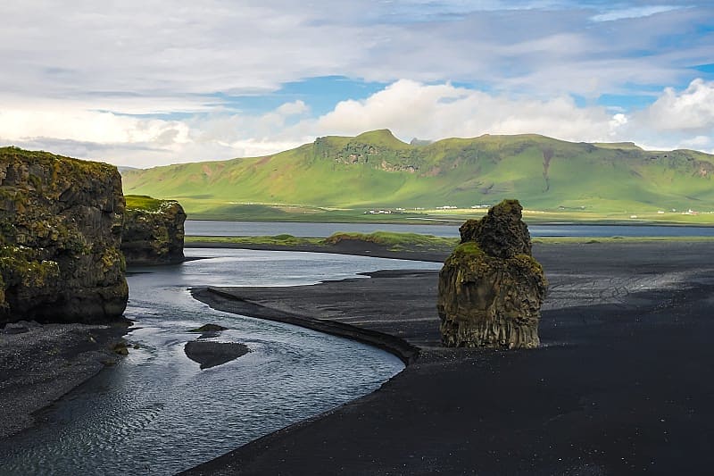 Venture across the tops of Dyrholaey to witness staggering views of black sand beaches and waves of the Atlantic