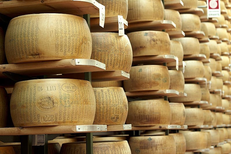 Spectacular Luxury Food Tour of Italy Wheels of parmigiano-reggiano on display in Parma, Italy
