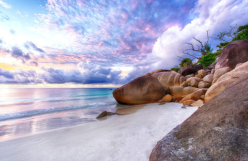 Dramatic sunset over the famous beach Anse Lazio, Praslin island, Seychelles.