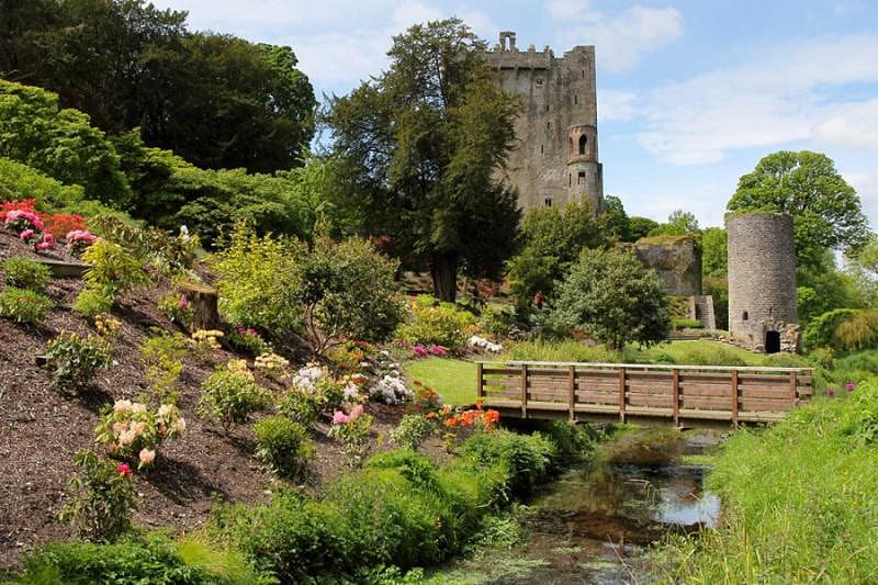 Blarney Castle with a bridge and flowers on the background