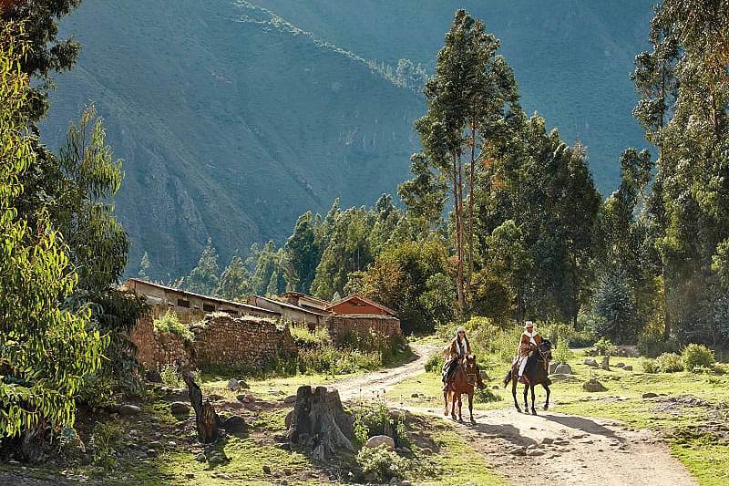 Couple horseback riding in the Urubamba Valley. Photo courtesy of Rio Sagrado, A Belmond Hotel Couple horseback riding in the Urubamba Valley
