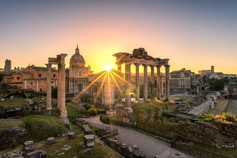 Sun rising over Roman ruins in Italy