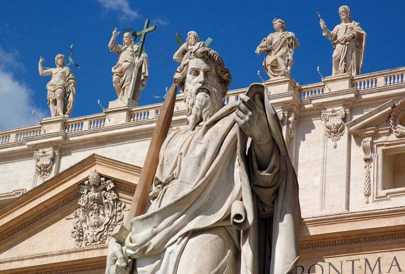 Statues of saints on top of St. Peter's Basilica in Rome, Italy