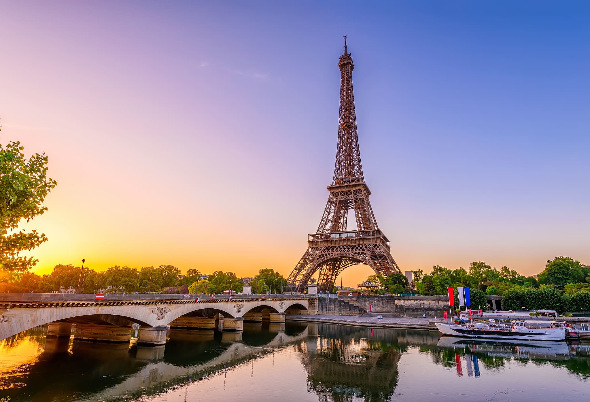 A river cruise on the Seine passing by the Eiffel Tower.