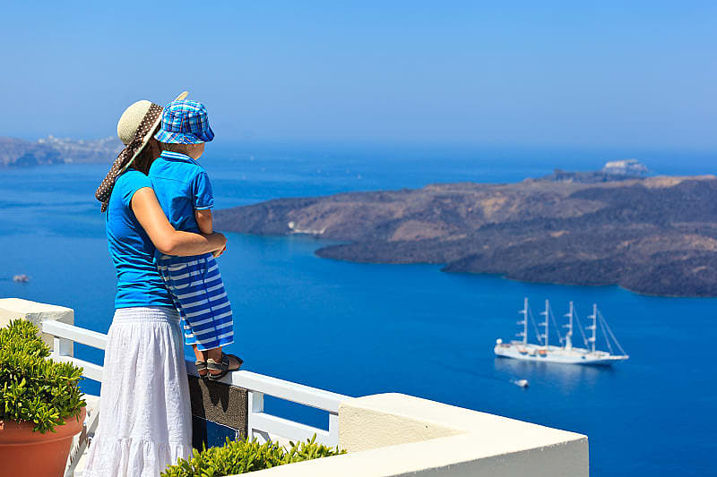 Tourists on the waterfront of Santorini, Greece