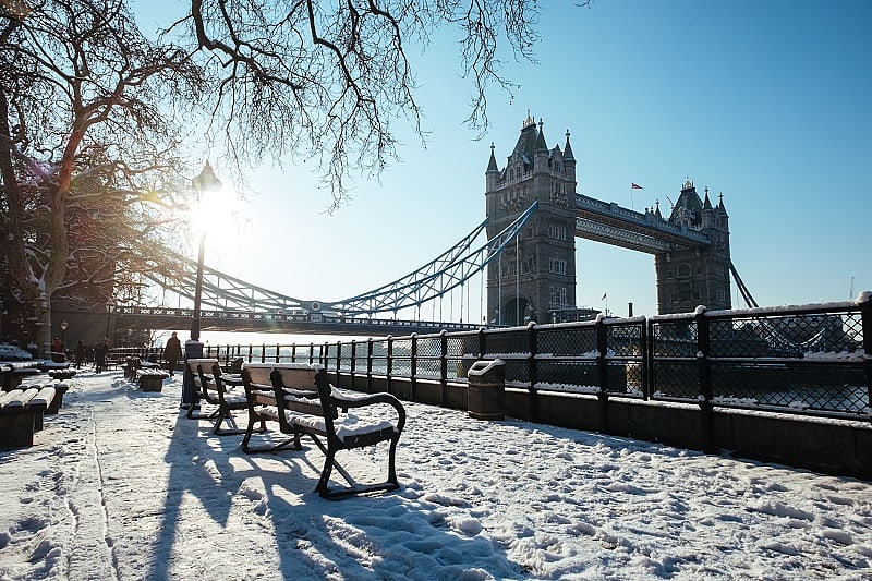 A Delightful London and Paris Winter Tour Winter snow with London Tower Bridge in England