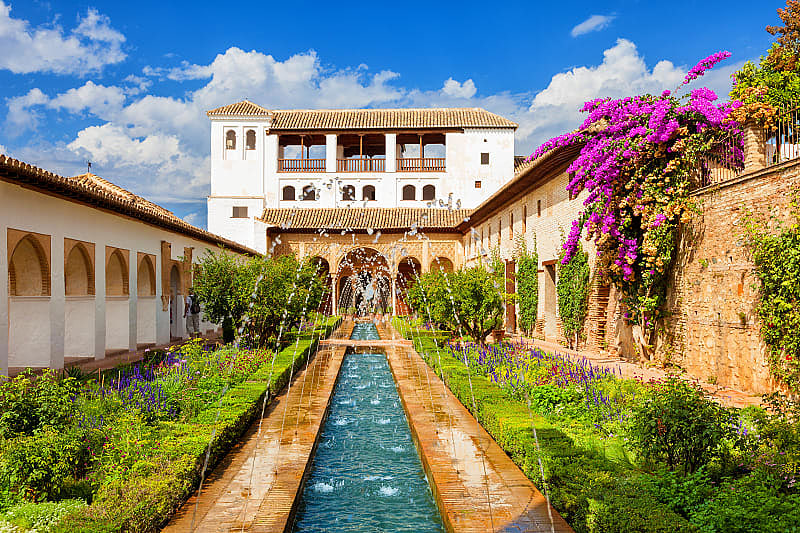 Romantic Andalusia: Granada, Cordoba, Seville Tour The Generalife with its famous fountain and garden at Alhambra in Granada, Spain
