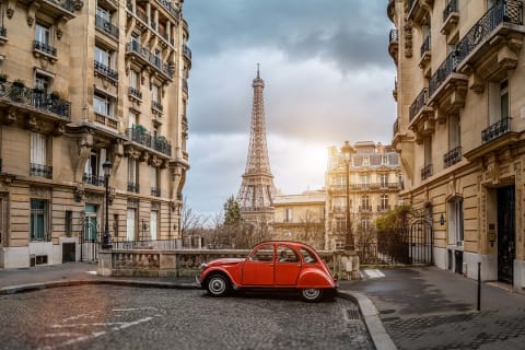 Small Paris street with view of the famous Eiffel Tower