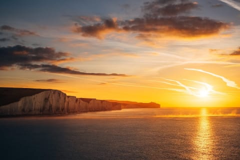 Sunrise over Seven Sisters chalk cliffs in East Sussex, England