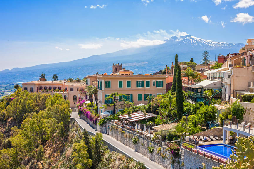 View of Taormina with Etna volcano in Sicily, ital