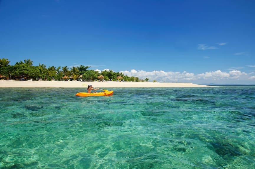 Woman kayaking in the Mamanuca Islands, Fiji