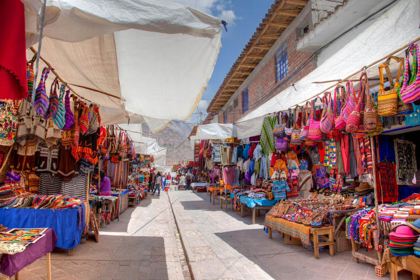 Colorful textiles at the Andean market in Pisac, Peru