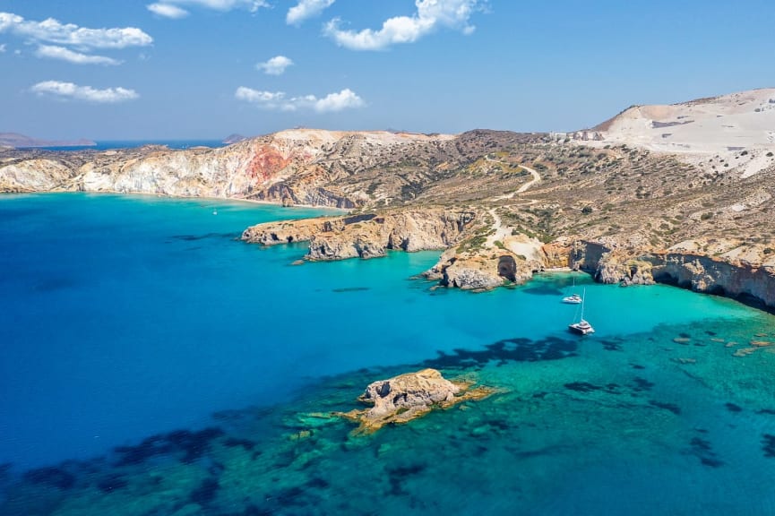 Coastline with cliffs, caves and beaches on the island of Milos, Greece