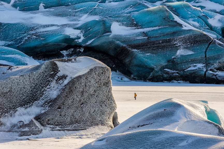 Hiker exploring Svínafellsjökull Glacier in Skaftafell National Park, Iceland