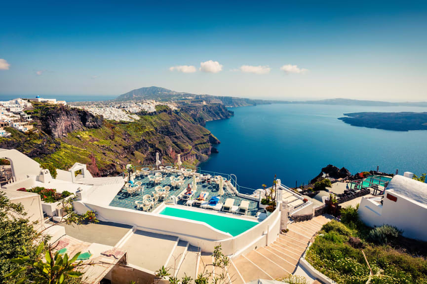 Resort pool and buildings bordering the Santorini Caldera