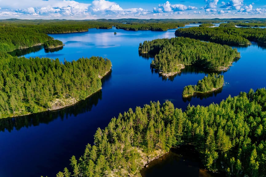 Blue lakes and green forests on a sunny summer day in Finland