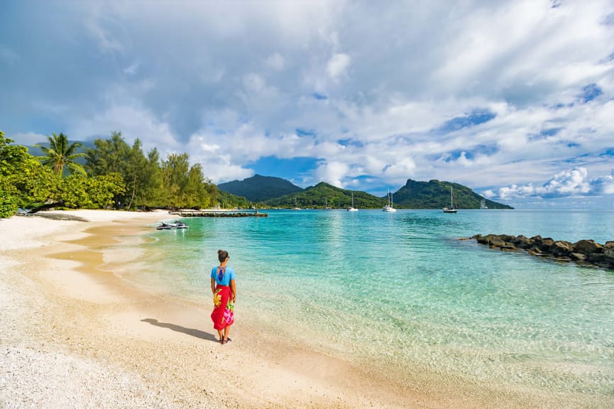 Woman enjoying beach view in Huahine Island, French Polynesia