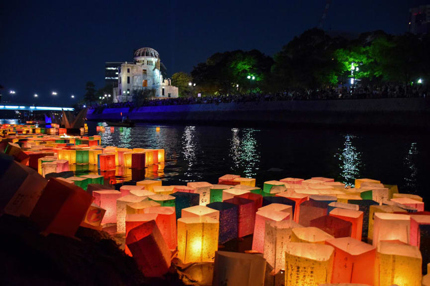 Paper lanterns set adrift on the river during Toro Nagashi in Hiroshima, Japan