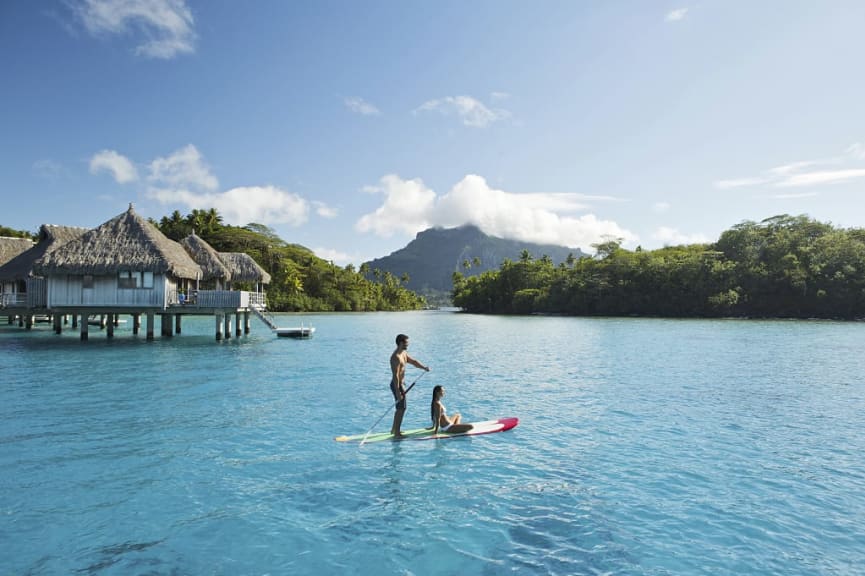 Couple standup paddle boarding in Bora Bora.  Photo courtesy Tahiti Tourisme