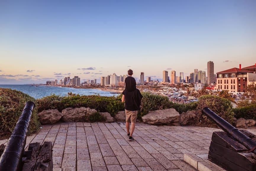 Family walking in Tel-Aviv at sunset Israel