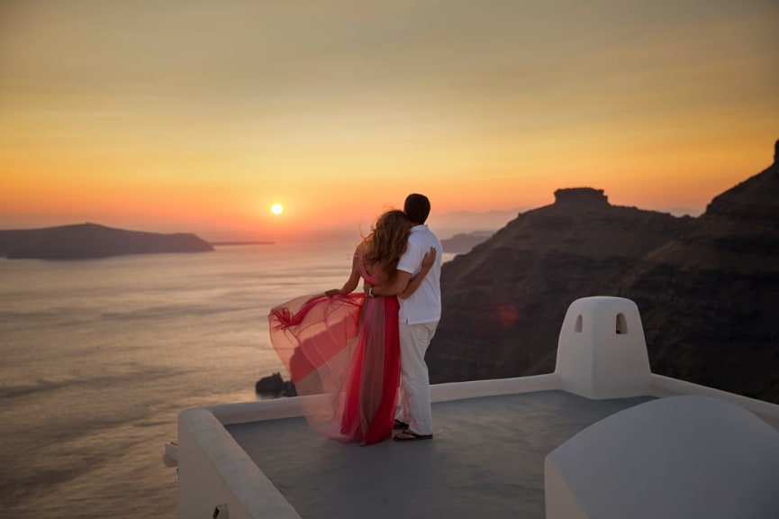 Couple in Santorini at sunset in Greece