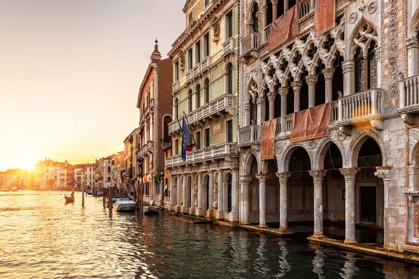 Venice at sunset, Italy with gondola Palazzo Santa Sofia is a palace on the Grand Canal