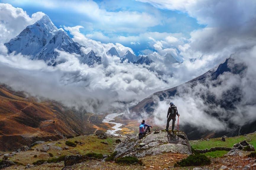 Hikers trekking to Everest base camp valley with Ama Dablam view in Nepal