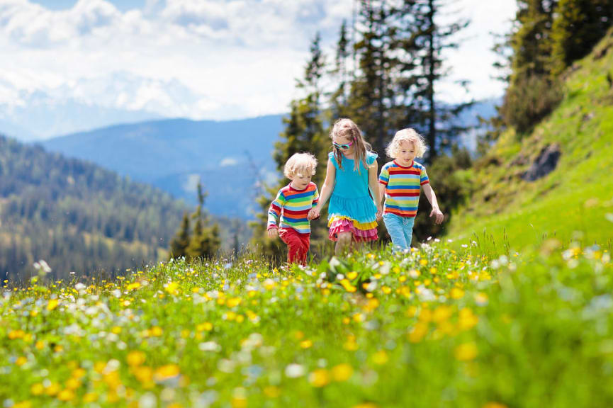 Kids walking in the Alps in Austria 