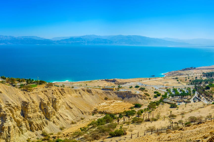 Mountains of Judean desert overlook the dead sea and its coastline at Ein Gedi beach in Jerusalem