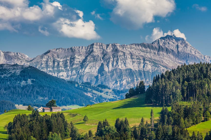 Green meadows and Mount Saentis in Switzerland's Appenzellerland