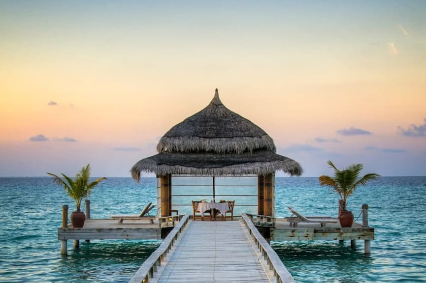 Romantic seaside dining at sunset in the Maldives