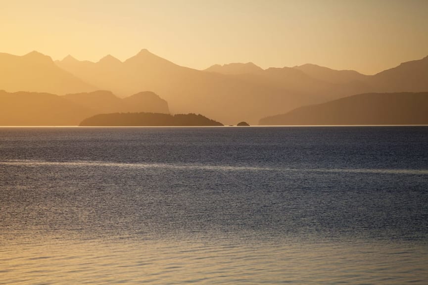 Sunset at Nahuel Huapi Lake, surrounded by mountains in Patagonia, Argentina