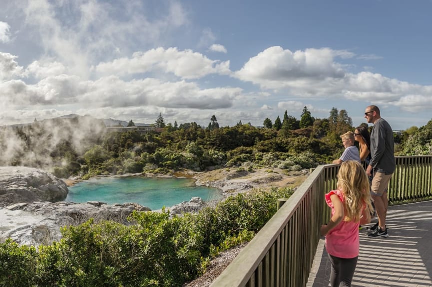 Family at geothermal lake in Rotorua, New Zealand