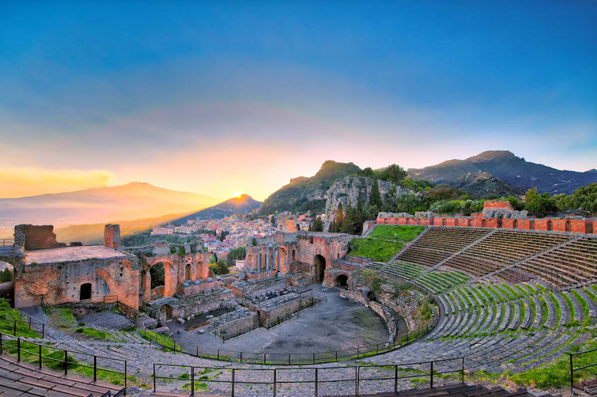 The ancient greek theater of Taormina with Etna volcano in the background