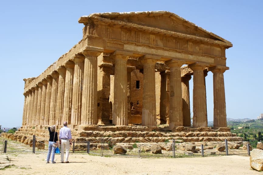 Senior couple at the Temple of Concordia in Agrigento Valley in Sicily, Italy