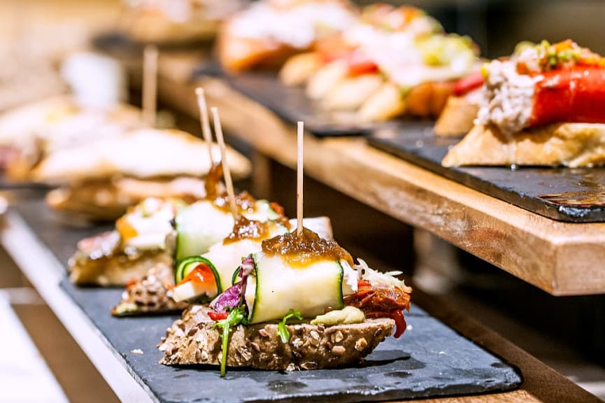 Variety of delicious Spanish pintxos waiting to be tasted