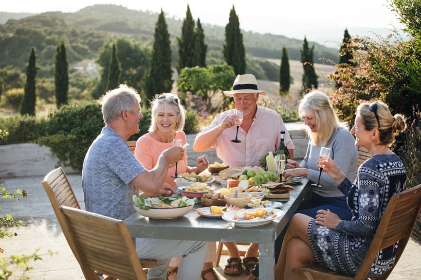 Seniors eating al fresco in Tuscany