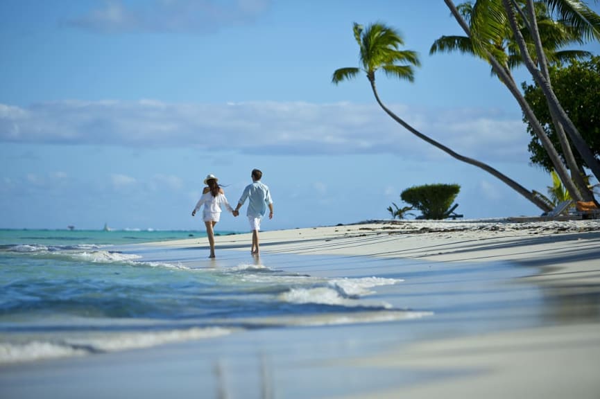 Couple walking on the beach in Bora Bora, French Polynesia