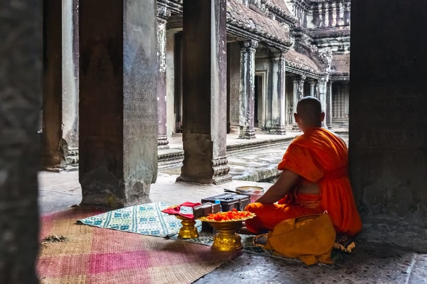 Buddhist monk ready to give blessings at Angkor Wat in Siem Reap, Cambodia.